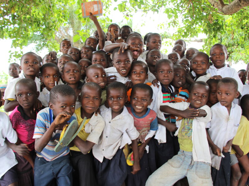 A group of African schoolchildren pose for a photo.